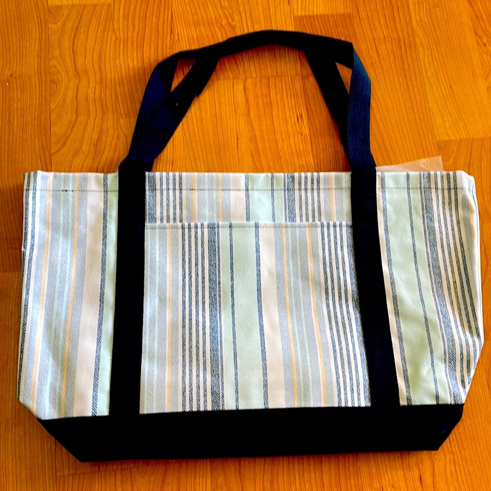 New in bag, never used.  Thirty-One Coastal Carry All “Boardwalk Stripe pattern”